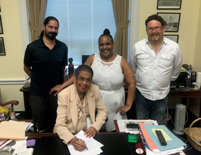 Nikolas Schiller, Sondra Battle, Adam Eidinger with Congresswoman Eleanor Holmes Norton as she signs the Marijuana in Federally Assisted Housing Parity Act of 2018 aka the Sondra Battle Cannabis Fair Use Act